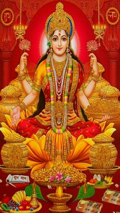 the hindu goddess sitting on top of a lotus with her hands up in front of her body