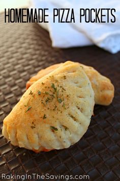 homemade pizza pockets on a baking sheet with the words homemade pizza pockets over it and in the background