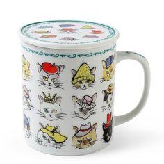 a coffee mug with many cats on it