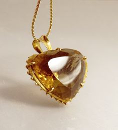 "Large 14K Gold Smoky Topaz Quartz Heart Pendant Vintage Jewelry Amazing, Large, Vintage Heart Pendant 14K Yellow Gold, High Basket Prong Setting, With Vertical Supports This Unique, Elegant Pendant Measures 1 1/4\" W x 1/8\" High  Not Including The Bail, 1.5\" With The Bail x 7/8\" Depth It Is Hallmarked For Gold On The Bail, But Unreadable As  To Maker Or Content Chain Is For Photos Only The Chain Is Not Included ! Jeweler Tested At 14K  Total Weight 17.5 Grams  jujubee1.etsy.com  To Browse My Antique Yellow Gold Heart Cut Jewelry, Antique Heart Cut Jewelry For Formal Occasions, Heirloom Heart Cut Gemstone Jewelry, Heart Cut Topaz Gemstone Jewelry, Heart Cut Topaz Jewelry For Anniversary, Heart Cut Topaz Jewelry Gift, Heart Cut Topaz Jewelry As Gift, Heart Cut Topaz Jewelry Perfect For Gifts, Heart Cut Topaz Jewelry For Gifts