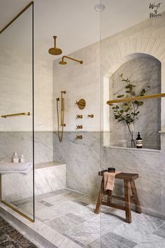 a bathroom with marble floors and walls