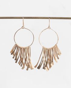 Inspired by mid-century African metalwork, gold-filled wire is measured and hammered into graduating fringes to create earrings with incredible light-catching movement. Ancient Greek Design, Greek Design, Block Island, Hammered Gold, The Ear, Gold Wire, Hudson Valley, Fringe Earrings, Tassel Necklace