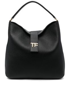 logo-plaque leather tote bag from TOM FORD featuring black, calf leather, grained texture, gold-tone logo plaque, logo stamp to the rear, strap and press-stud fastening, single flat top handle, internal slip pocket and main compartment. Size Info UNI Color Detail Black Made In Italy Material Outer: Calf leather 100% Lining: Polyamide 60% Polyurethane 40% Season One Fall-Winter Season Two Fall-Winter Product bags.. Brand Tom Ford Size And Fit Width 15,75 in / 40 cm Height 14,96 in / 38 cm Depth 3 Everyday Calf Leather Bag With Logo, Chic Business Shoulder Bag With Logo Plaque, Timeless Rectangular Shoulder Bag With Gold-tone Logo, Luxury Shoulder Bag With Logo Plaque And Top Handle, Luxury Shoulder Bag With Top Handle And Logo Plaque, Formal Top Handle Shoulder Bag With Logo Plaque, Modern Formal Bag With Logo Plaque, Modern Formal Bags With Logo Plaque, Classic Top Handle Bag With Logo Plaque