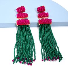 Doll up for your next night out with these dazzling resin tassel drop earrings! These earrings are the perfect accent for any outfit and will make everyone want a pair! With their unique shape and fun tassel detail, these stylish earrings will have heads turning wherever you Trendy Dangle Chandelier Earrings For Party, Chic Beaded Drop Earrings For Parties, Chic Party Beaded Drop Earrings, Trendy Tassel Earrings With Dangling Beads, Trendy Fringe Drop Earrings, Tassel Chandelier Drop Earrings For Parties, Tasseled Chandelier Drop Earrings For Party, Trendy Fringe Earrings For The Beach, Trendy Party Tassel Earrings