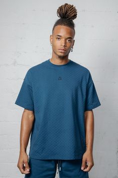 This boxy tee is crafted from jacquard checkered fabric, giving it a unique and stylish look. With a back yoke design, this tee offers a comfortable and flattering fit for any occasion. 96% Cotton 4% Spandex Models are 6'2" and wearing a size medium Oversized Jacquard Knit Crew Neck Top, Casual Jacquard Knit Tops For Streetwear, Casual Jacquard Knit Top With Relaxed Fit, Casual Short Sleeve Textured Top, Cotton Jacquard Knit Short Sleeve Tops, Casual Textured Short Sleeve Top, Everyday Textured Knit Short Sleeve Tops, Casual Textured Crew Neck Top, Textured Crew Neck Casual Tops