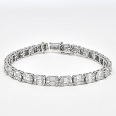 Make sparkle a priority with this glamorous diamond tennis bracelet. Fabulous and dramatic, this dazzling round-shape and baguette diamond Bracelet is a perfect accent to everyday and evening looks. Artfully set in 18k white gold, this exquisite bracelet features the soft shimmer of diamond baguette gorgeously enhanced by round-shape diamond in a cluster setting. Metal: 18kt White Gold Weight:14.52 Grams Gemstone: Natural Diamonds Shape: Round Brilliant/ Baguette Total Carat Weight: 5.88CT Avera Diamond Baguette, Cluster Bracelets, Diamond Tennis Bracelet, Wedding Jewelry Bracelets, Tennis Bracelet Diamond, Baguette Diamond, Diamond Cluster, Wedding Bracelet, Tennis Bracelet