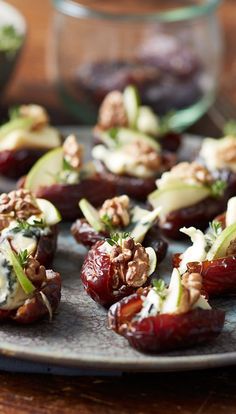 an assortment of appetizers on a plate ready to be eaten