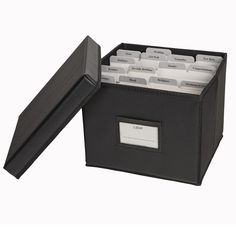 a black file box filled with files on top of a white background