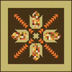 a brown and orange quilt with an arrow design on the center, surrounded by smaller squares