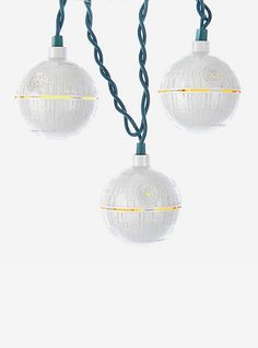 two white globe lights hanging from a string