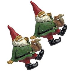 two green and red garden gnomes sitting next to each other