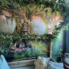 a bedroom with a tree mural on the wall