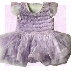 Fao Lavender Layered Tulle Dress, Matching Diaper Cover. Lavender Tulle Dress With Ruffles, Purple Tulle Dress With Ruffles, Fitted Ruffle Fairy Dress For Dress-up, Fitted Fairy Dress With Ruffles For Dress-up, Lavender Princess Dress With Ruffles, Lavender Princess Style Sleeveless Dress, Lavender Princess Sleeveless Dress, Princess Style Sleeveless Lavender Dress, Sleeveless Purple Fairy Dress With Ruffles