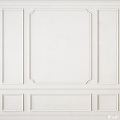 an empty room with white walls and paneling