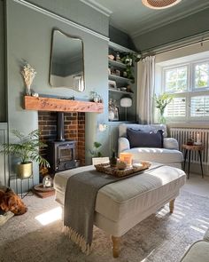 a living room filled with furniture and a fire place