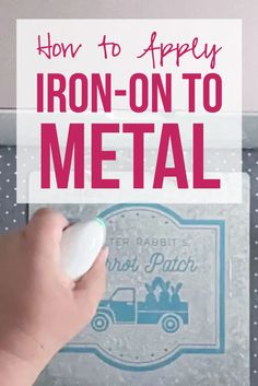 a hand holding a mouse in front of an iron - on to metal sign with the words how to apply iron - on to metal