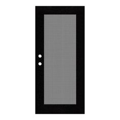 a black door with two white dots on the glass and one is in front of it