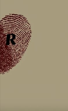 a fingerprint with the letter r on it is shown in front of a brown background