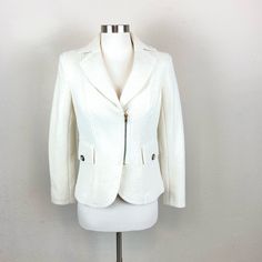 Cache Ivory Side Zip Jacket With Beautiful Pocket And Button Detailing In A Size Extra Small. Come With One Replacement Button. New With Tags. Perfect Condition! Lay Flat Measurements- Pit To Pit 18”-, Shoulder Arm Length- 23 1/2”, Underarm Length- 14”. Shell- 100% Boiled Wool, Lining 97% Polyester, 3% Spandex. Tailored White Outerwear With Button Closure, White Outerwear With Snap Buttons For Work, Fitted Winter White Outerwear For Office, White Snap Button Outerwear For Work, Chic White Outerwear With Snap Buttons, Tailored White Button-up Blazer, White Tailored Button-up Outerwear, White Tailored Button-up Blazer, Chic Fitted Winter White Blazer