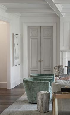 a living room filled with furniture and white walls