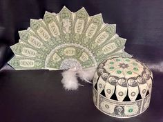 an origami fan and money gift box with the words custom money gifts written on it