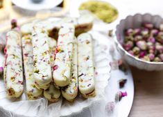 there are many different types of food on the plate and one is white with pink flowers