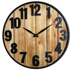 a clock made out of wood with numbers on the face and around the outside of it