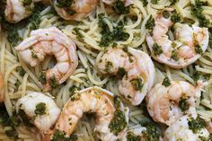 pasta with shrimp, broccoli and pesto on it