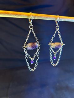 Artisan designed and handcrafted earrings, dangle chandelier earrings with purple and dreamy Amethyst, with sterling silver chain. The dreamy amethyst is faceted and amazing!  Total measurement is 2 1/2  inches in length including sterling silver lever back earring wire, drop length 1 3/4 inch, width 1 1/4 inch long. Twist Beads, Earring Wire, Purple Jade, Earrings Unique, Artisan Design, Handcrafted Earrings, Focal Bead, Earrings Dangle, Amethyst Gemstone