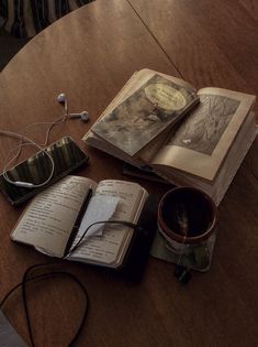 an open book sitting on top of a wooden table