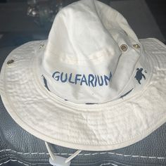 Gulfarium Beach Hat Cream Color With Navy Turtle And Sharks On It Comes With String For Neck That Tightens Casual Cream Cotton Sun Hat, White Casual Sun Hat For Outdoor, Casual White Sun Hat For Outdoor, Casual Cream Hat With Upf 50+, Casual Cream Bucket Hat, Casual White Bucket Hat, White Cotton Sun Hat For Outdoor, Casual White Sun Hat With Upf 50+, Hat Cream