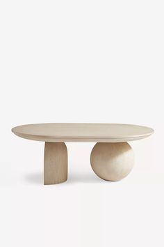 an oval table with two wooden bases