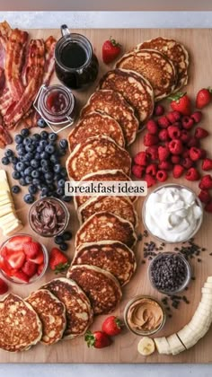 pancakes and fruit are arranged on a cutting board with the words pancake boards are a so please pass