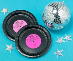 disco balls and plates on a blue background