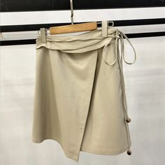 Beautiful Leather Waistband Miniskirt Summer Office Mini Skirt, Beige Mini Skirt For Office In Summer, Beige Office Mini Skirt For Summer, Summer Office Skirt Short Length, Beige Asymmetrical Mini Skirt For Workwear, Beige Mini Skirt For Office Spring Season, Beige Mini Skirt For Office In Spring, Beige Mini Skirt For Spring Office Wear, Solid Mini Skirt For Office In Spring