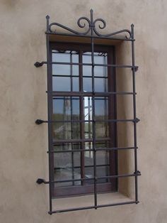 a window with bars on the side of it