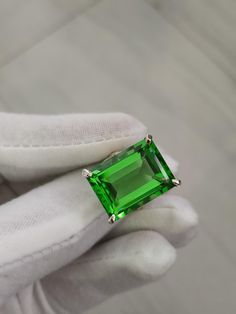 ITEM SPECIFICATION ¶ Metal Type: Sterling Silver. ¶ Metal Stamp or Hallmark: .925 ¶ Metal Purity: 92.5% Sterling. ¶Center Gemstone: Lab Peridot  ¶Center Stone Measurements: 15x20mm ¶ Approximate Center Stone Carat Weight: 21.76 Carats Emerald Cut Ring, Green Gemstone Ring, Octagon Shape, Emerald Cut Rings, Green Gemstones, Rings For Her, Metal Stamping, Gemstone Ring, Emerald Cut