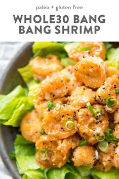 a bowl filled with shrimp and lettuce on top of a white table cloth