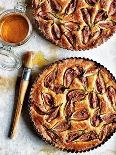 two pies sitting next to each other on top of a table