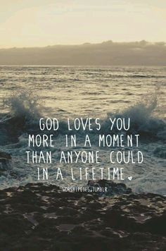 an ocean with waves crashing on the shore and a quote about god loves you more in a moment than anyone could in all time