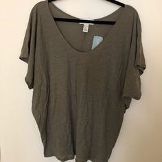 Color Is Olive. Oversized On Arms And Fitted At Waist. Cute Fit Just Never Wore It. 50% Cotton 50% Modal. Smoke Free Home. Oversized V-neck Casual Tops, Trendy Slouchy Tops For Everyday, Casual Slouchy Tops For Loungewear, Slouchy Casual Cotton Tops, Casual Cotton Slouchy Tops, Trendy Batwing Sleeve Loungewear Top, Trendy Batwing Sleeve Tops For Loungewear, Trendy Loungewear Tops With Batwing Sleeves, Slouchy Short Sleeve Tops For Loungewear