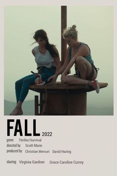 two women sitting on top of a wooden structure with the words fall in front of them