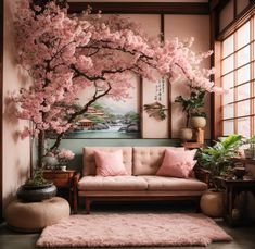 a living room filled with furniture and lots of pink flowers on the tree in front of it