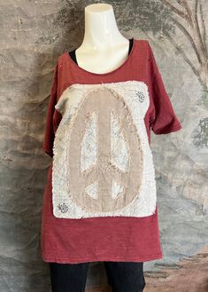 Jaded Gypsy Rock the Cutest Peace Sign Applique with Jaded Gypsy's Perfect Tee! Simple Distressing to Take Your Look to the Next Level! Cold water wash and hang to dry Made in the USA Bohemian Red Cotton T-shirt, Red Relaxed Fit Top For Festival, Pre-washed Short Sleeve Graphic Tee, Bohemian Distressed Short Sleeve T-shirt, Red Bohemian Cotton T-shirt, Red Cotton T-shirt For Festival, Bohemian Pre-washed Cotton Tops, Red Short Sleeve T-shirt For Festivals, Red Short Sleeve Festival T-shirt