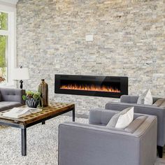 a living room filled with furniture and a fire place in the middle of the room