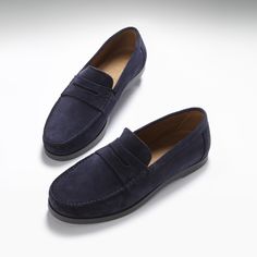 Here we offer you another Hugs & Co. take on a classic style. Our penny loafer upper made with carefully selected blue Italian suede is teamed with a robust boat shoe sole in slate grey rubber. This gives the shoes great wearability, fantastic comfort and the timeless style you're looking for in a penny loafer. We also offer loafers with tassels and driving shoes here at the Hugs & Co. online store. Our men's shoes are super cool and made to the tip top highest standards with leathers and suedes from England and Italy. If you're after preppy shoes or men's moccasins then you've come to the right place. UK Sizing Made in Portugal 100% Suede Upper featuring a 100% Leather Lining Rubber studded sole Navy Suede Loafers With Rubber Sole, Navy Suede Slip-on Loafers, Navy Slip-on Loafers With Leather Sole, Classic Blue Moccasins With Suede Lining, Blue Suede Moccasins With Plain Toe, Navy Leather Sole Loafers With Round Toe, Navy Loafers With Leather Sole And Round Toe, Navy Suede Loafers For Formal Occasions, Suede Boat Shoes With Plain Toe For Business