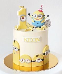 a birthday cake with minion characters on it