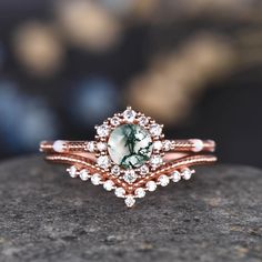 a close up of a ring on top of a rock