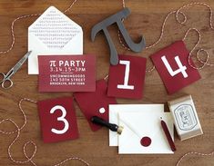 a table topped with lots of red and white cards