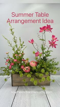 a wooden box filled with pink flowers on top of a white wood floor next to a sign that says summer table arrangement idea